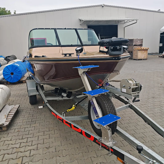 ShiftStep stainless-steel boat trailer ladder installed beside a boat bow